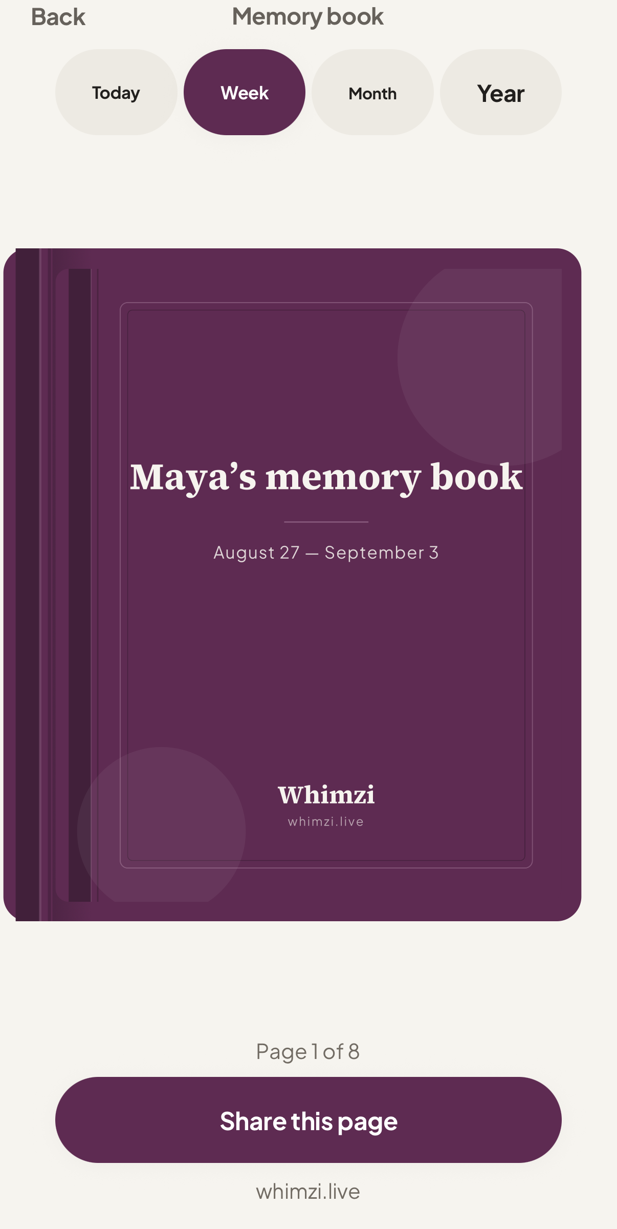 The memory book, closed: a plum cloth hard cover with the owner's name on it.