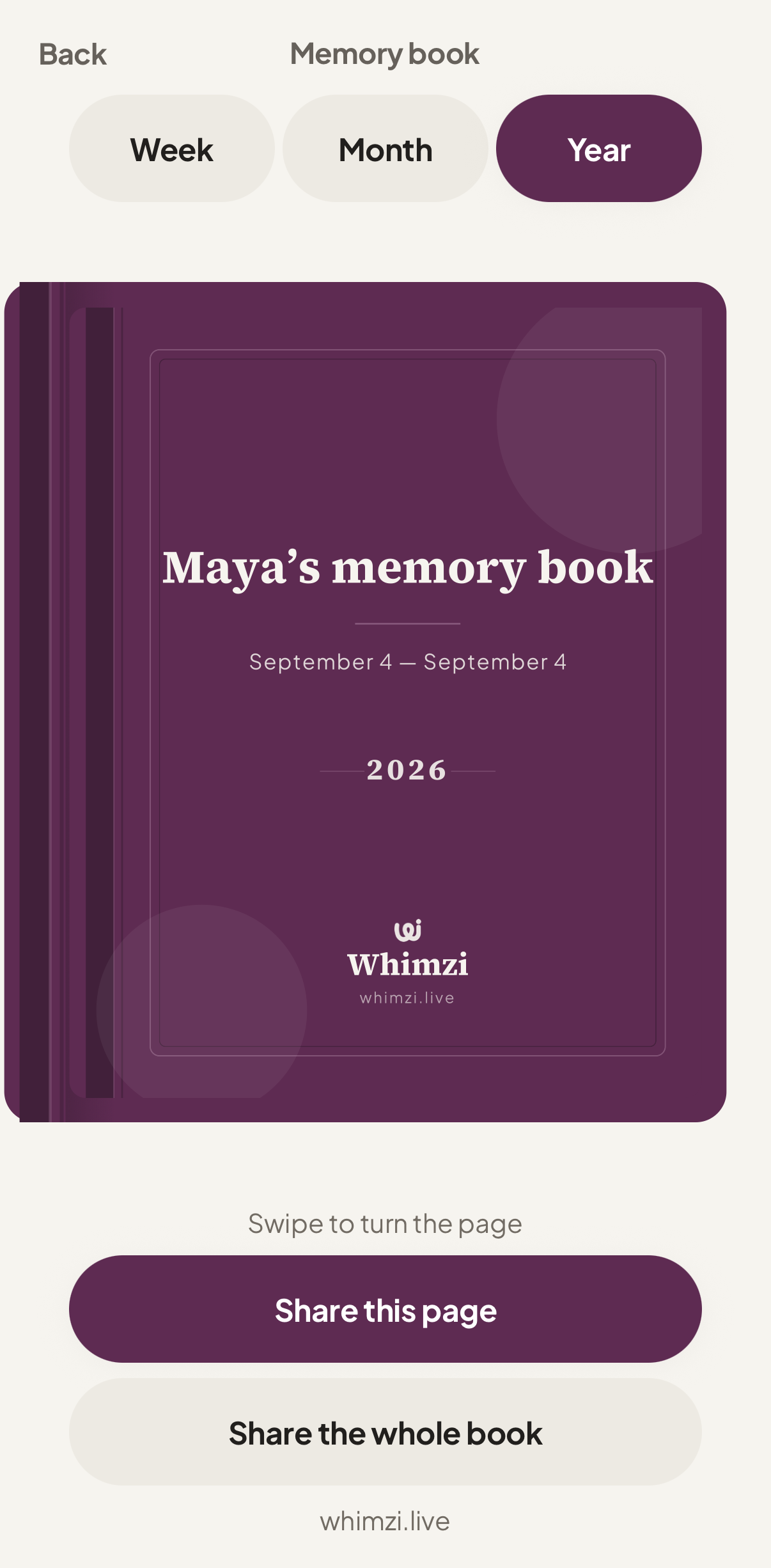 The memory book, closed: a plum cloth hard cover with the owner's name on it.